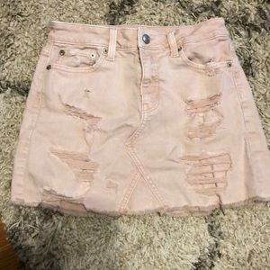 Pink ripped denim skirt